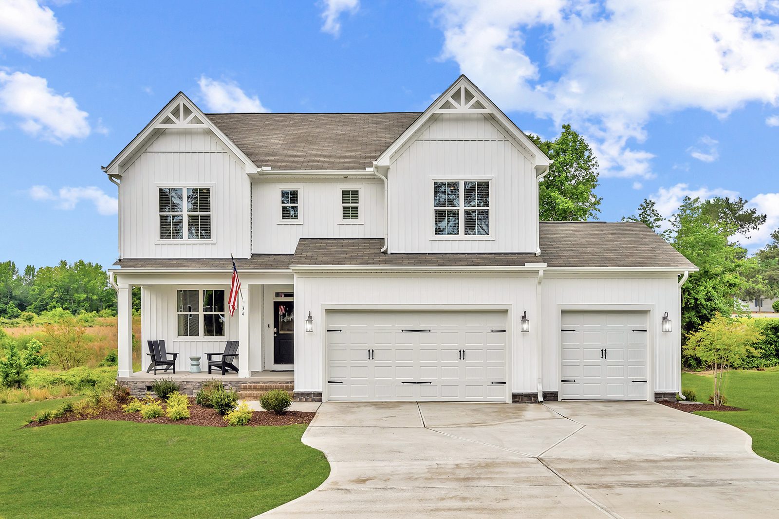 The Watauga floorplan exterior, a two-story home with a three-car garage